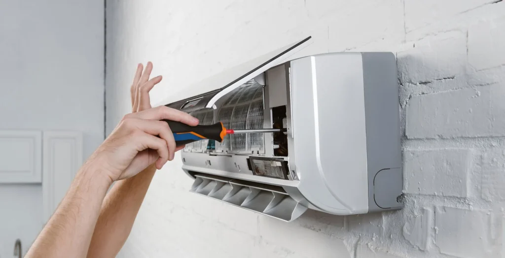 ac-repairman-taking-off-filter-from-ac